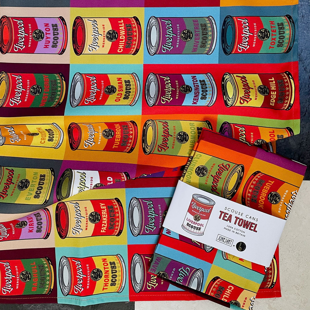 JONES ART X ISAAC’S BAZAAR SCOUSE CANS TEA TOWEL